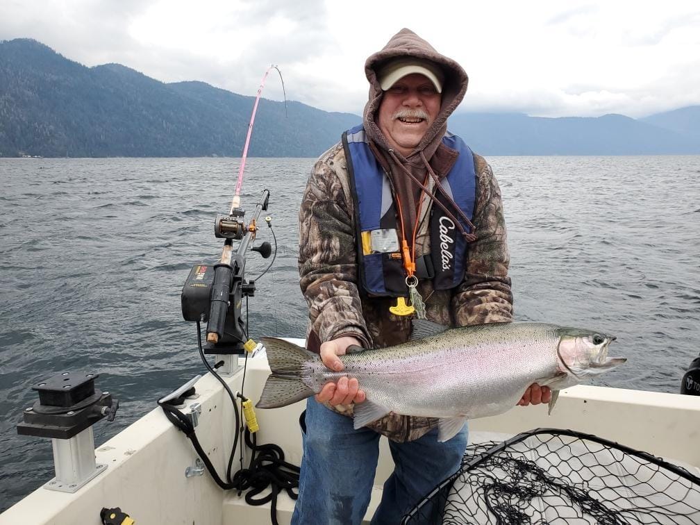 Photo credit: Dennis Lydeen. Angler with a rainbow trout from Lake Pend Oreille