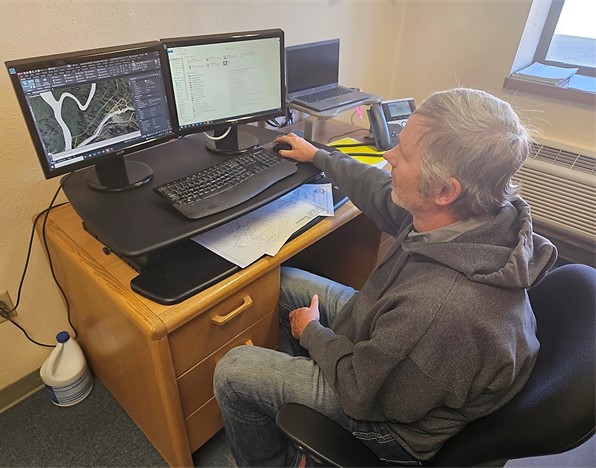 photo of Jared working on engineering design program in the office