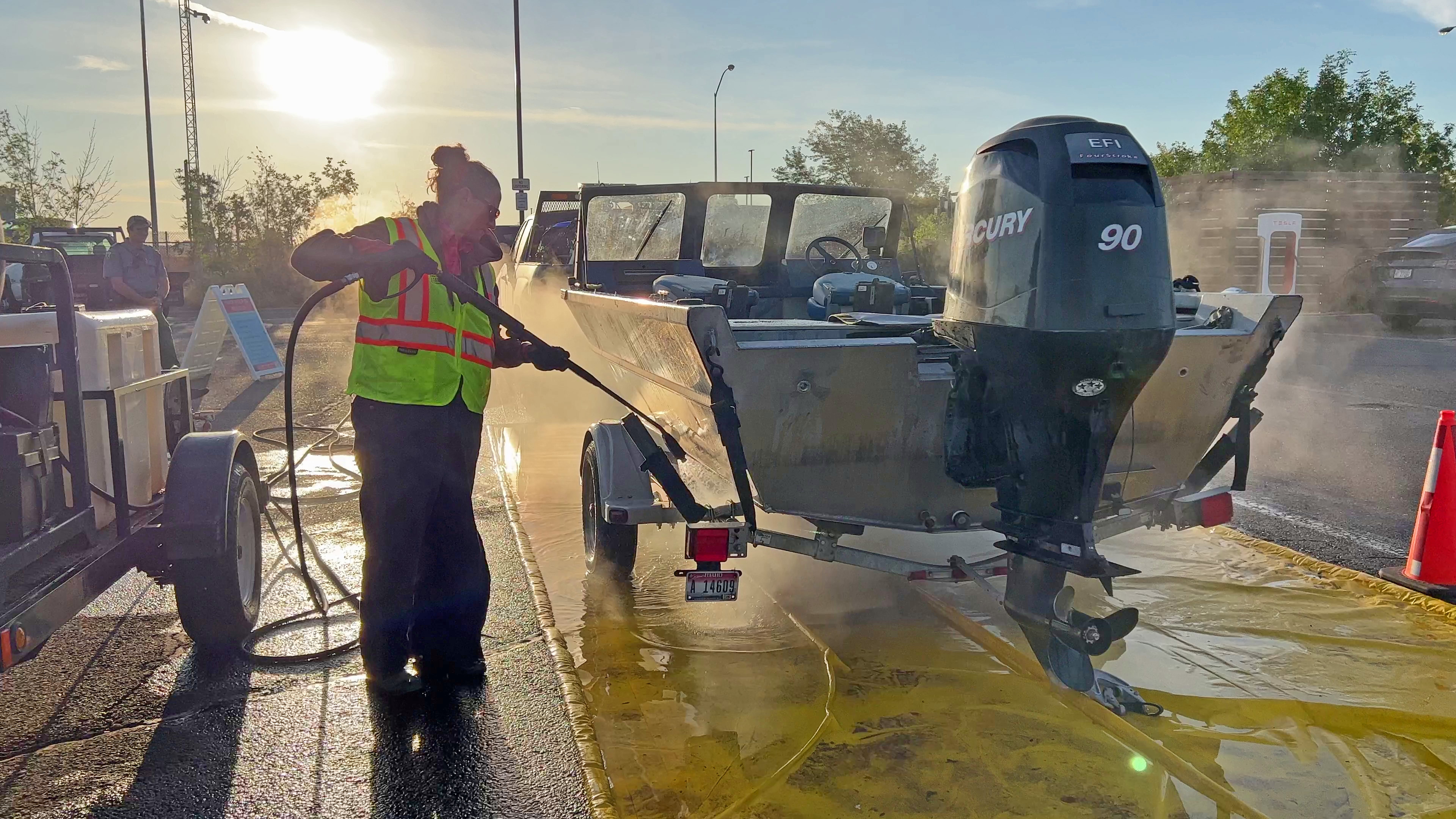 A boat is decontaminated for quagga mussels at the Twin Falls hot wash station