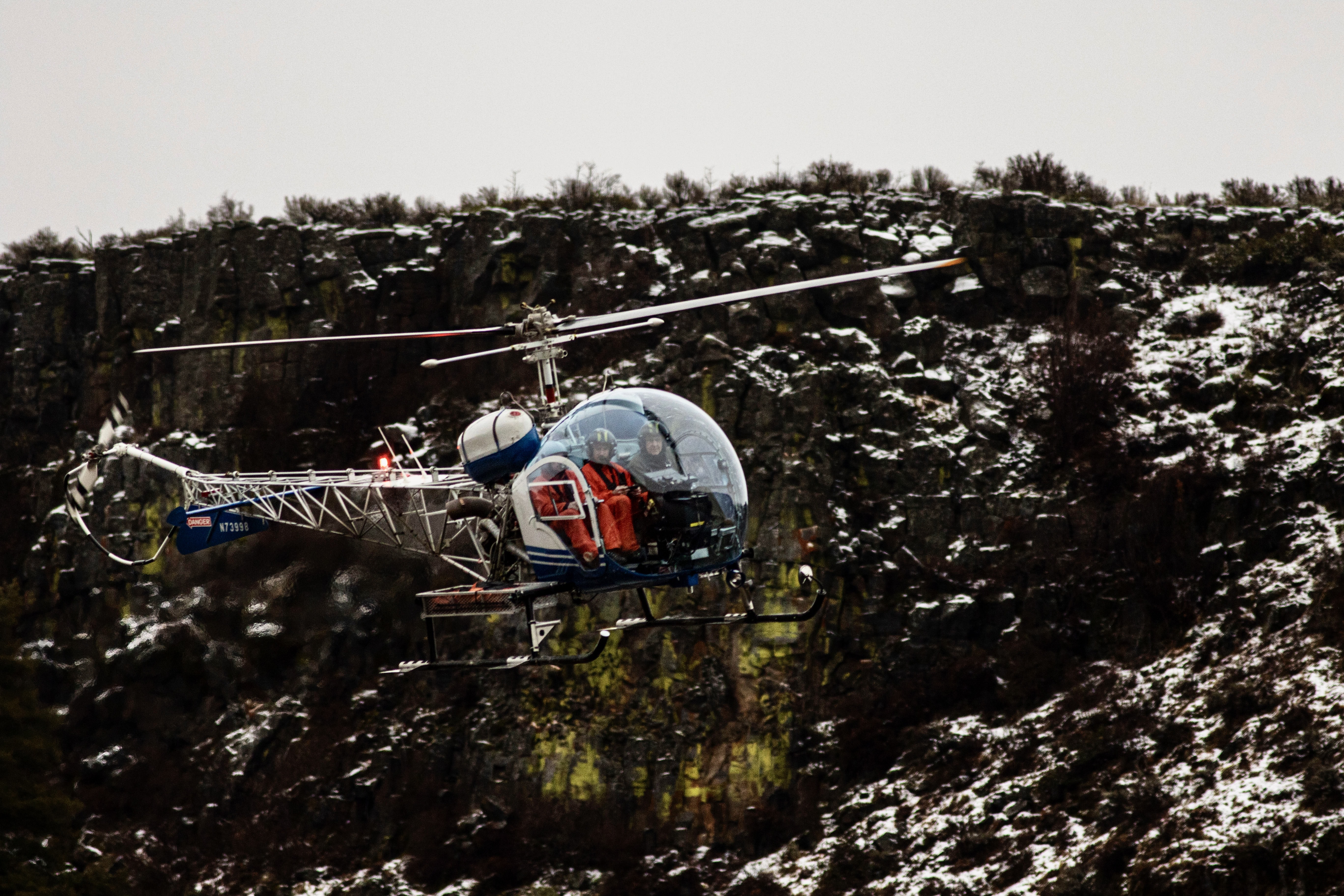 Fish and Game staff and a helicopter pilot fly the 2023 mule deer herd composition survey in Unit 39