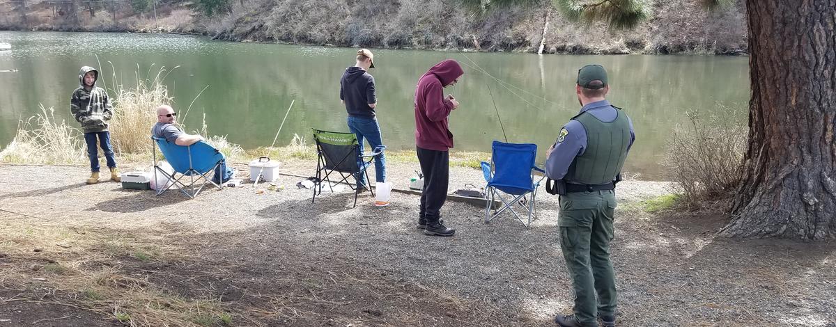 Fish and Game Conservation Officer contacting a sportsmen