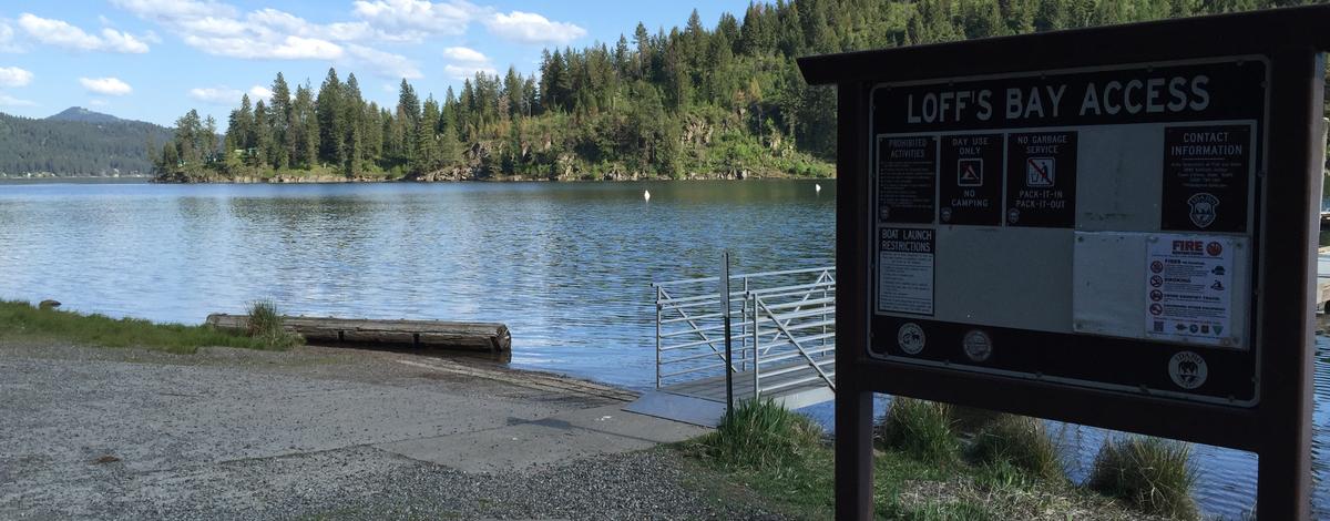 Loffs Bay Access informational sign boat ramp and dock access on Lake Coeur d 'alene medium shot May 2016