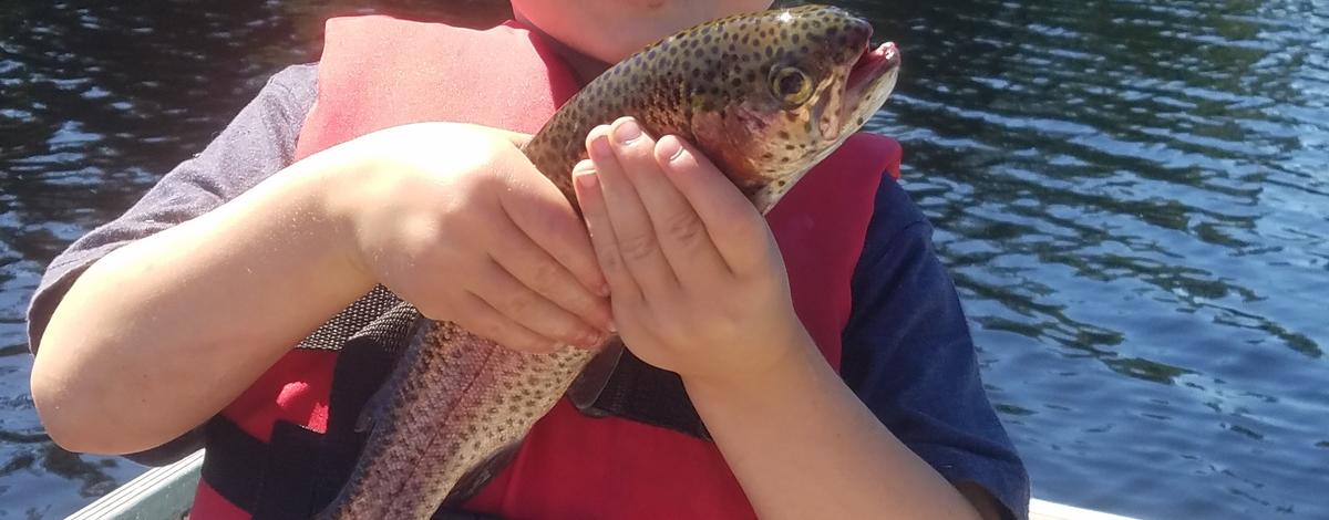 Kid with trout
