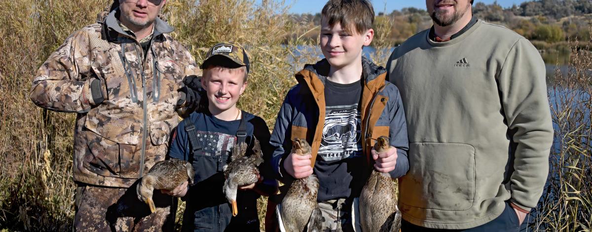 Two young boys with their mentors at the youth duck hunt at the Hagerman WMA November 2024