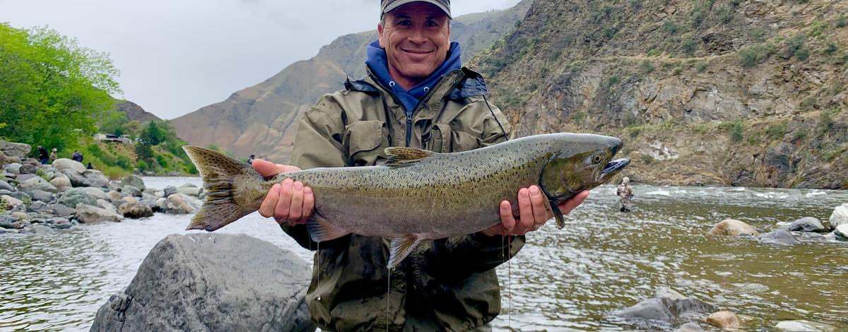 Angler holding a spring Chinook caught near Riggins