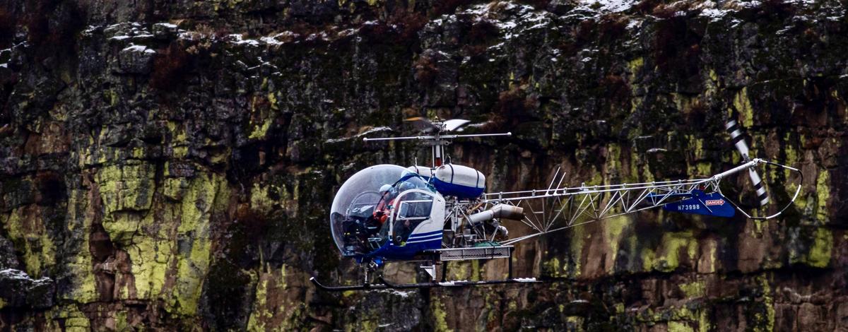 Fish and Game staff and a helicopter pilot fly the 2023 mule deer herd composition survey in Unit 39