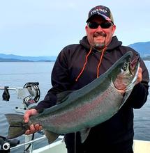 Angler on Lake Pend Oreille with rainbow trout