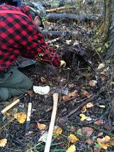 trapper setting a trap vertical shot October 2014