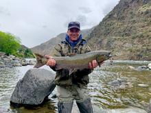 Angler holding a fall Chinook caught near Riggins